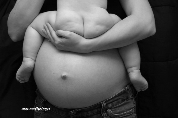 pregnant belly and baby bum 