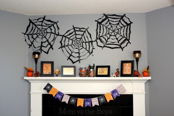 DIY large trash bag spiderwebs