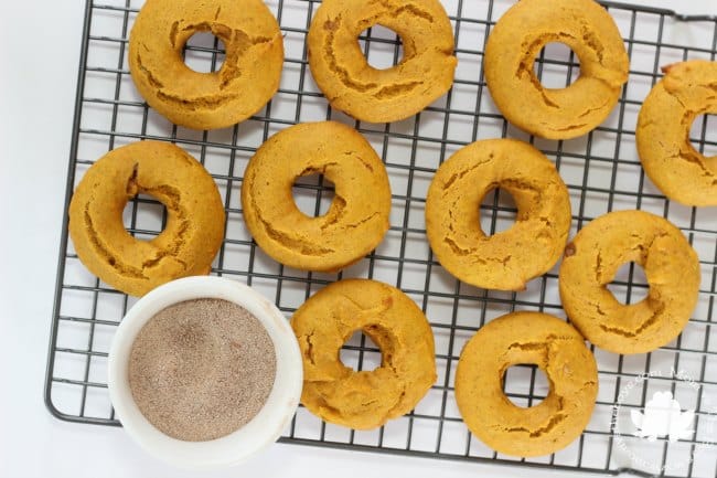 pumpkin donuts on rack with sugar 